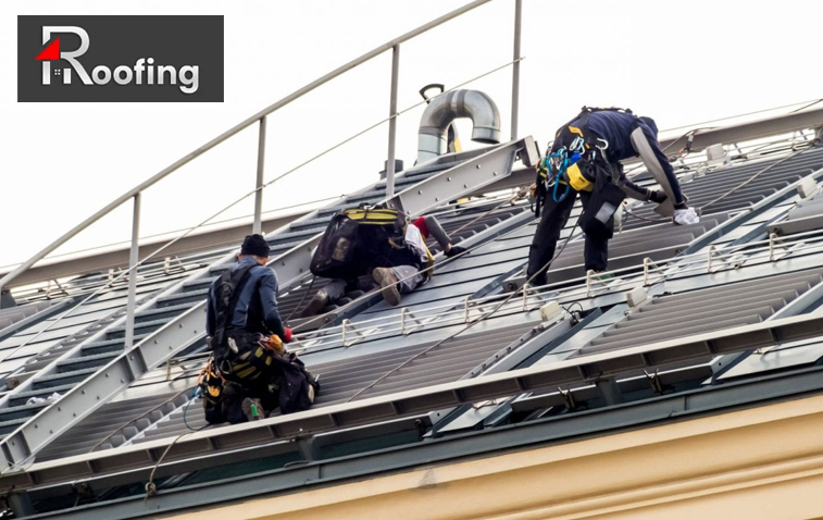 Roofing professionals replacing a commercial roof