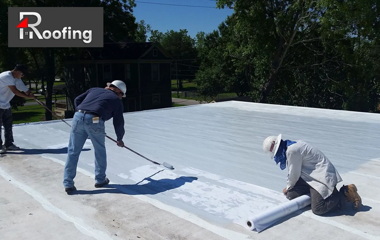 Contractors working on commercial roof replacement